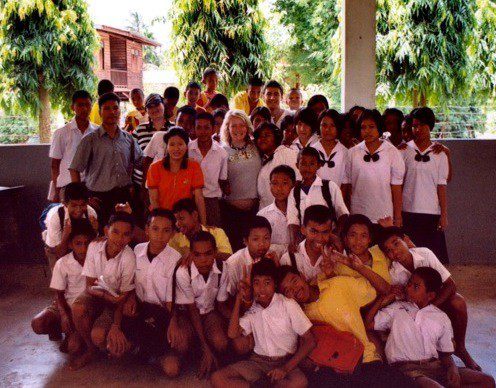 The school team, with lush foliage in the background.