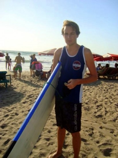 Squinting in the bright sun on Kuta Beach, with ruined ribs!