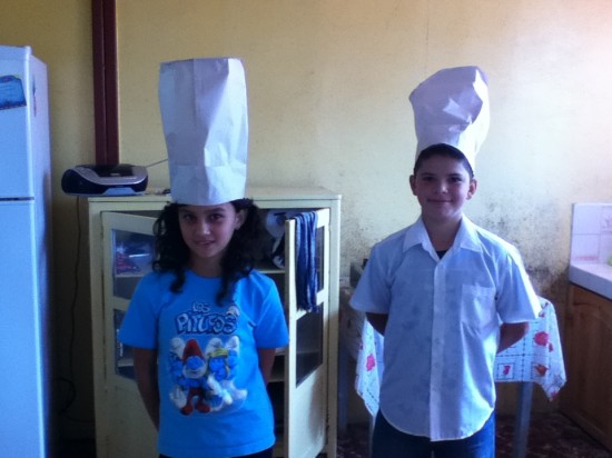 Fifth grade students creating a restaurant dialogue.