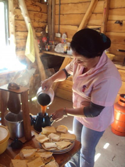 Erin's host mom making breakfast: coffee with tortillas and cheese.