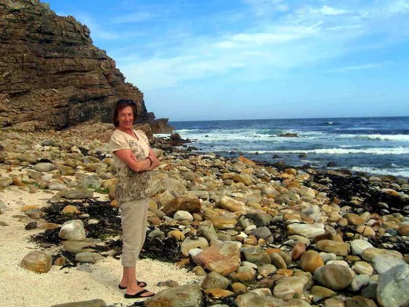 Bill's wife standing at the Cape of Good Hope.