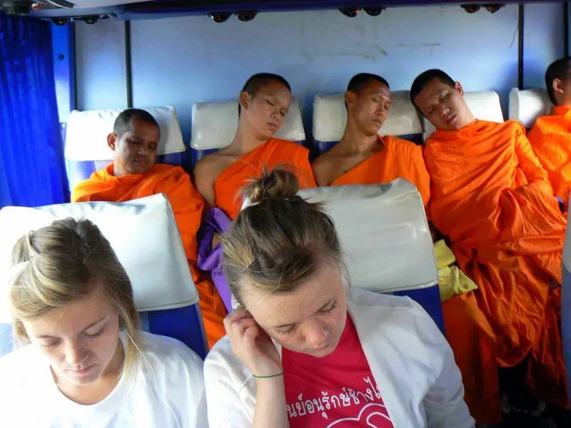 Monks and Randy's daughter on a Thailand bus! 
