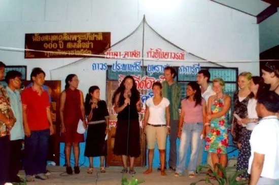 A volunteer presentation, with lovely Thai writing in back!
