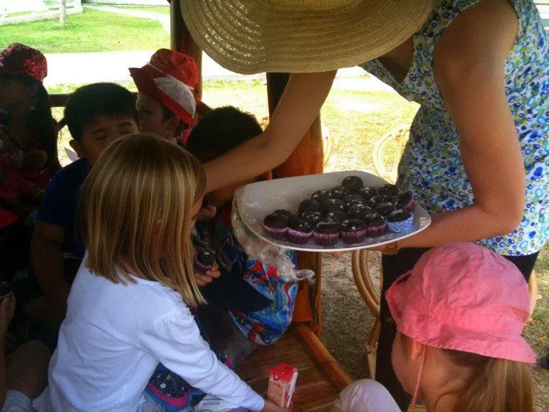 Candice handing out tasty treats while teaching.