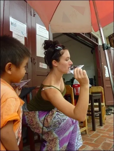 Teaching How To Make A Paper Airplane In Laos.