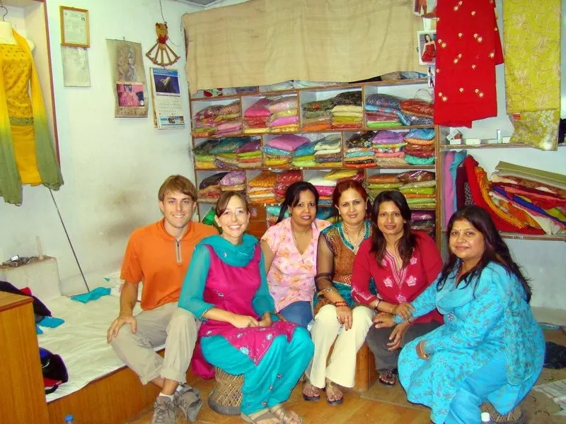 Jacob shopping for teacher clothes (salwar kurta) with his wife with their amma from their home stay.