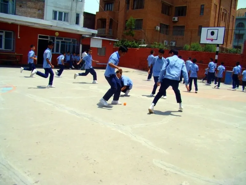 Soccer in the sun-scorched courtyard between classes.