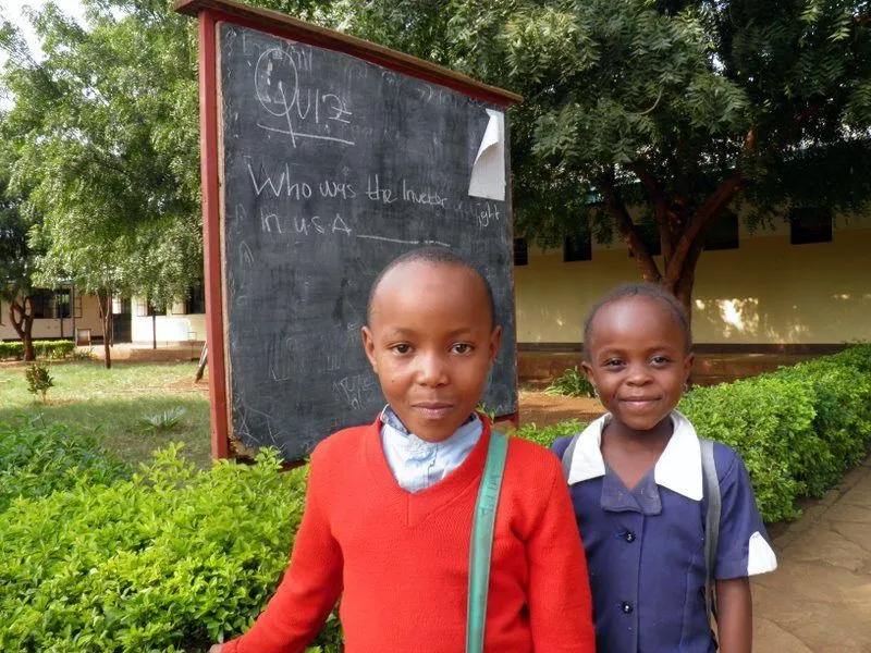 Children in Tanzania asking Francine a question.
