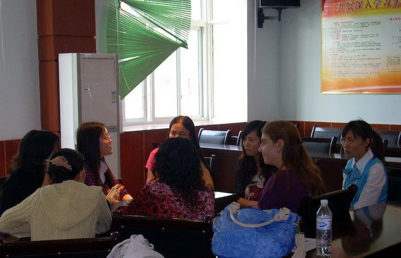 Meeting with the English teaching staff of a local Chinese middle school discussing ways to implement Western teaching methods.