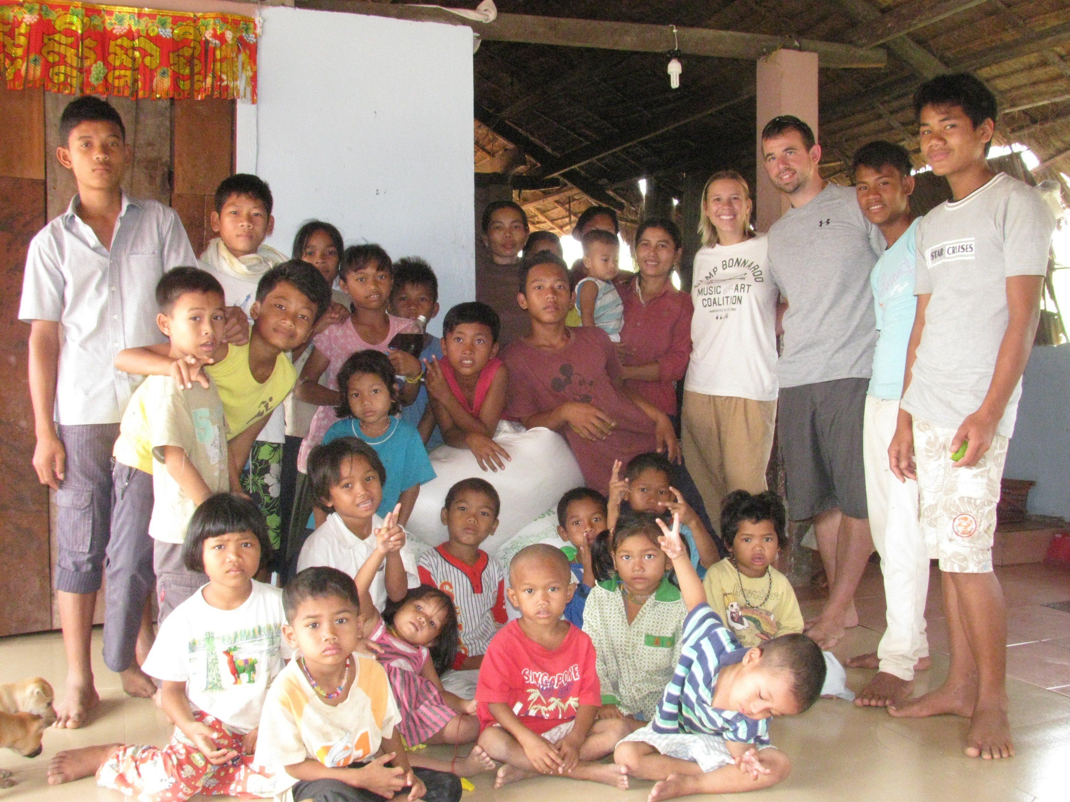 Tim and Robin with the welcoming community in Siem Reap.