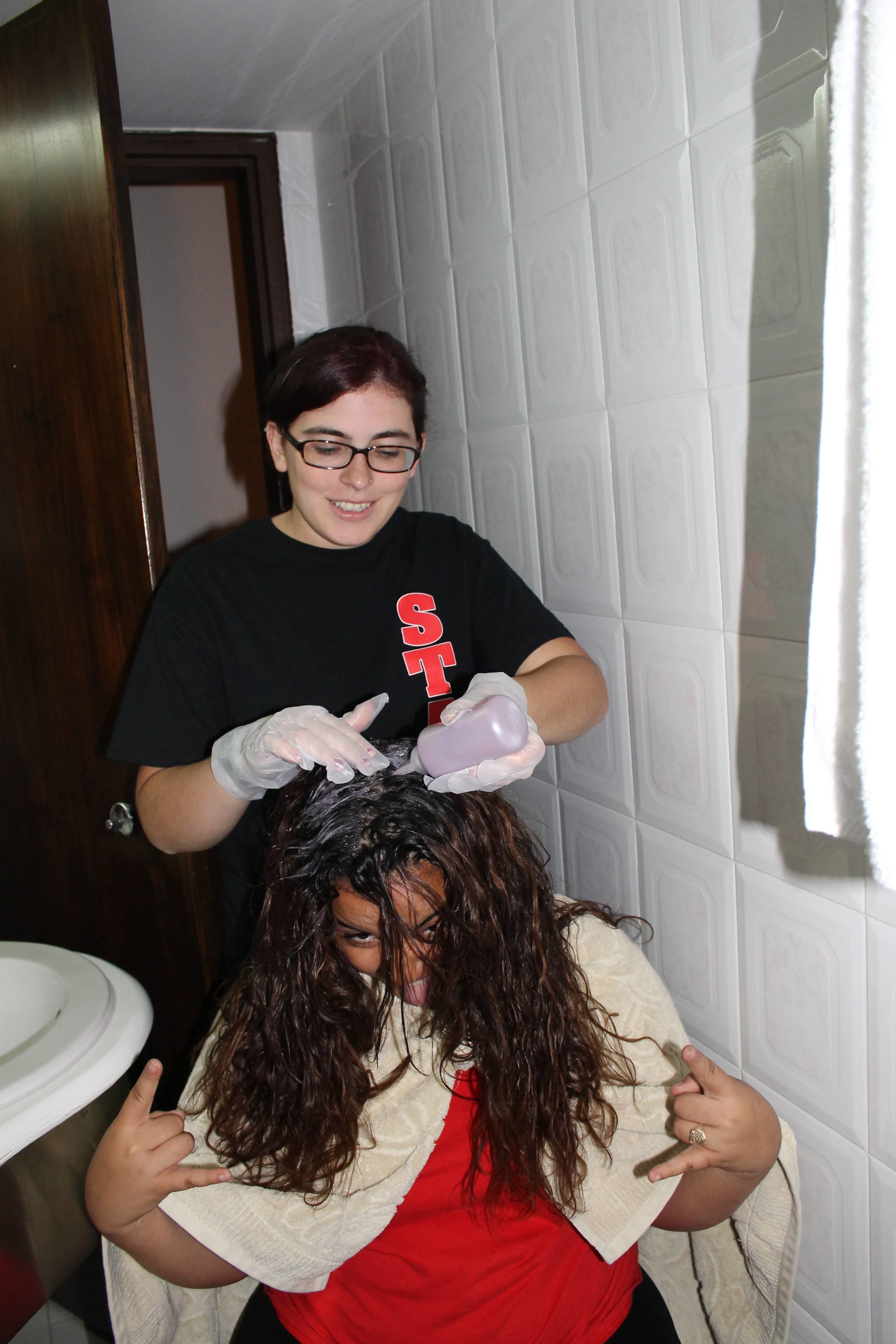 Delia dying a co-worker's hair on a slow weekend on-duty.