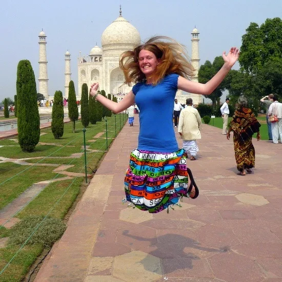 Chelsea, jumping for joy at the Taj Mahal, India.