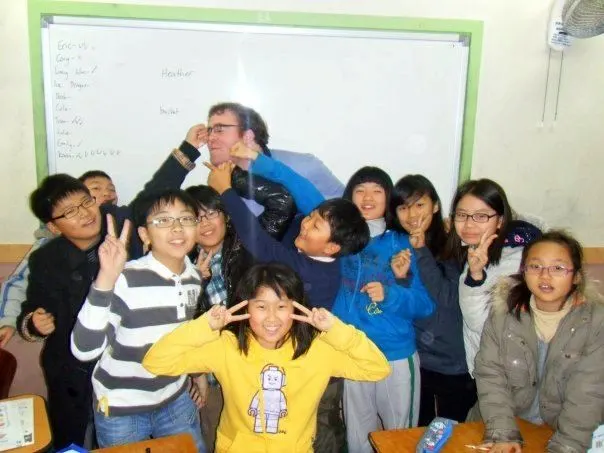 Happy students punching Chris in the face.