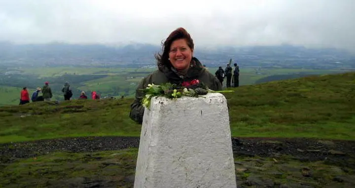 Alexandra at the top of Pendle Hill in England.