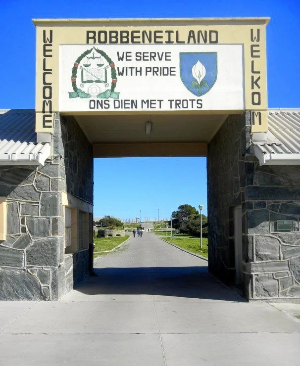 Ready to enter Robben Island Prison &ndash; where Nelson Mandela spent 18 years (The motto over the gate (We Serve With Pride) is just too weird!)