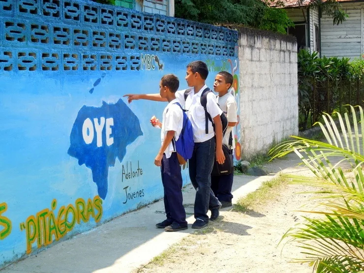 Students stop to admire the changes being made to the front of their school.