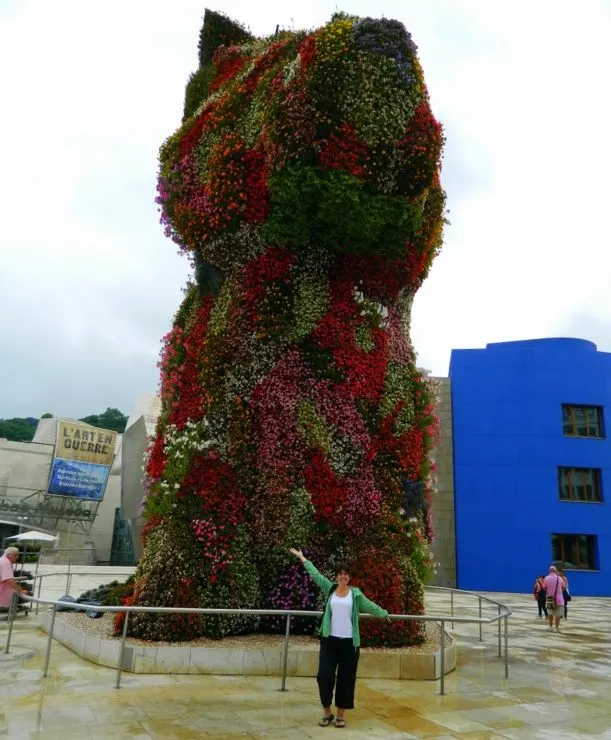 Jeff Koon's Puppy, a 43-foot flower topiary of a puppy standing guard at the front of the Guggenheim Museum in Bilbao, Spain.