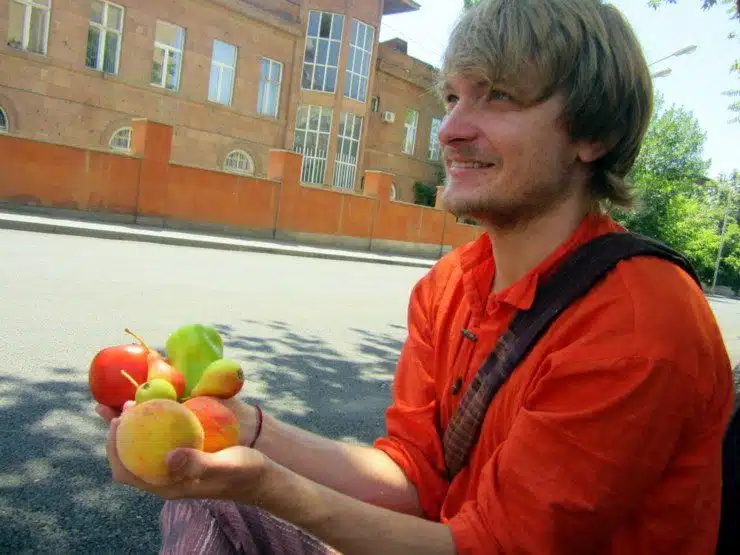Eric being given free fruit in Armenia.