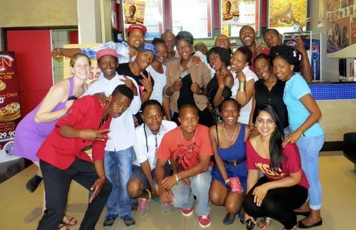 Mica with Club Empower students at their end of the year pizza party.