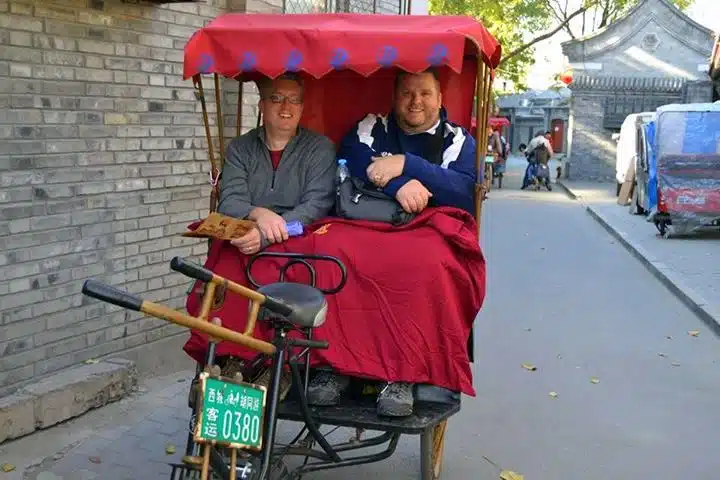 Mike with Nate Seelow, a traveling teacher from South Dakota, riding in a rickshaw in Beijing.