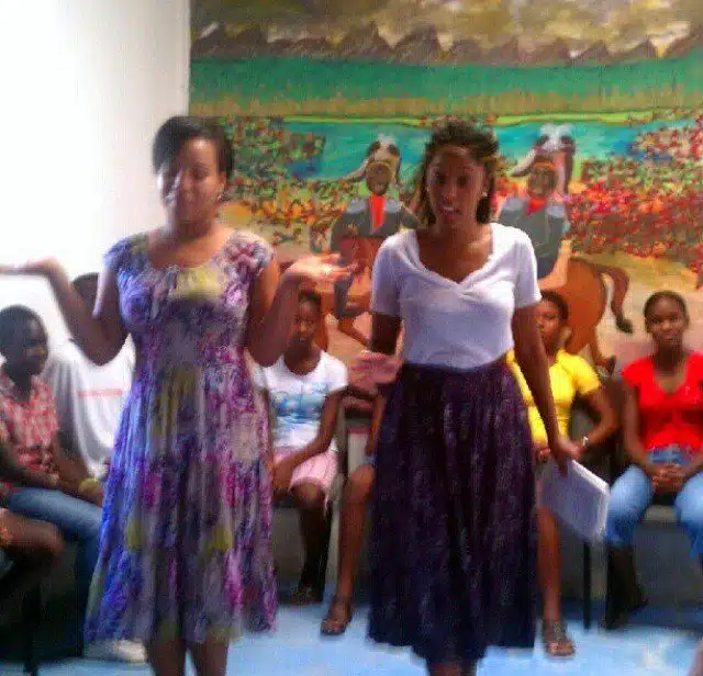 Shelah (right) teaching STW students in Haiti, August 2013.