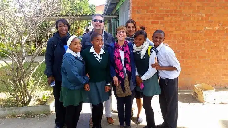 Posing with students in South Africa.