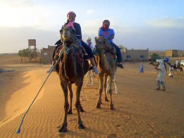 Reagan in Morocco with Agape Spiritual Center... learning to ride a camel!