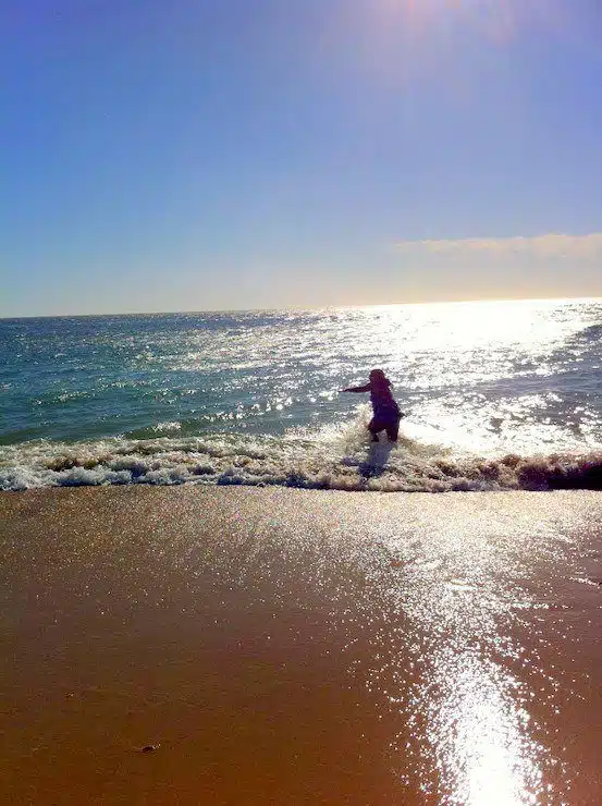 Frolicking in the ocean in Spain.