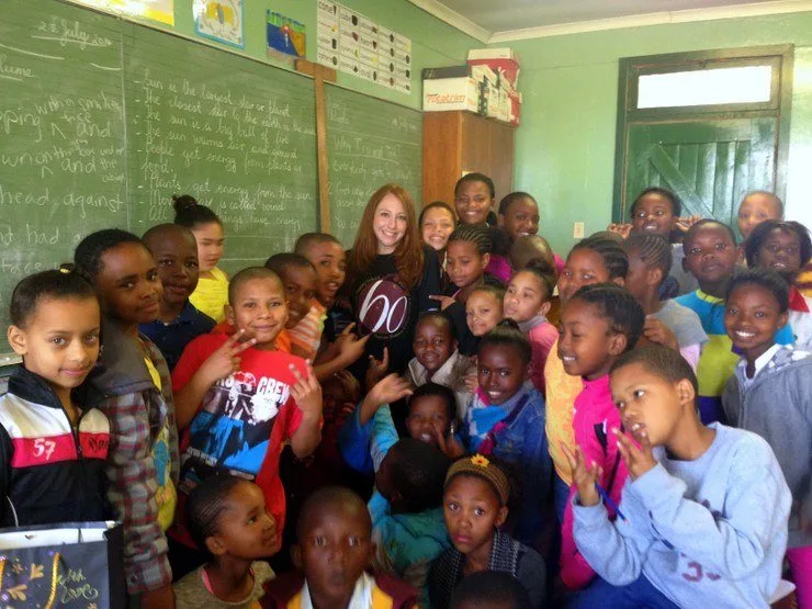 Stephanie with students in South Africa.