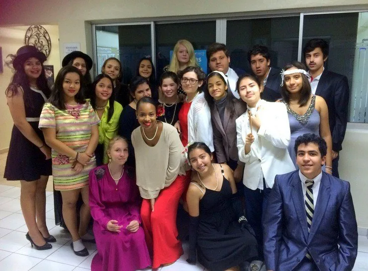 Jamilah's lovely, lovely students in the Dominican Republic. After studying the Harlem Renaissance, students performed original autobiographical poems while dressed as their Harlem Renaissance contributor. Jamilah is in the center.