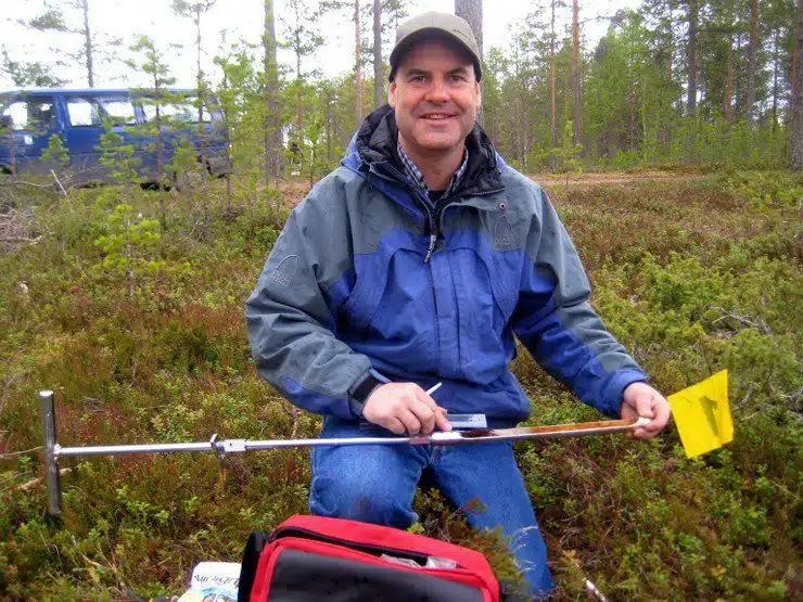 Sampling soil in Finland.