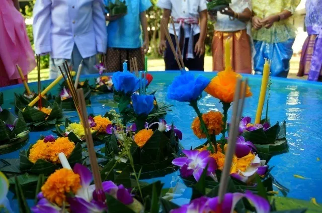 Casey's students floating 'Krathongs' in the water for a Thai holiday.
