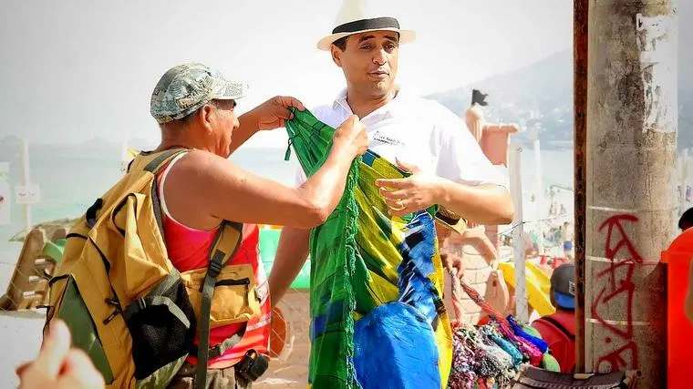 At Ipanema Beach, recording a video about fashion bikinis!