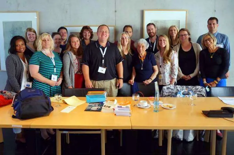Karen with her study tour group in Germany, meeting a Holocaust survivor.