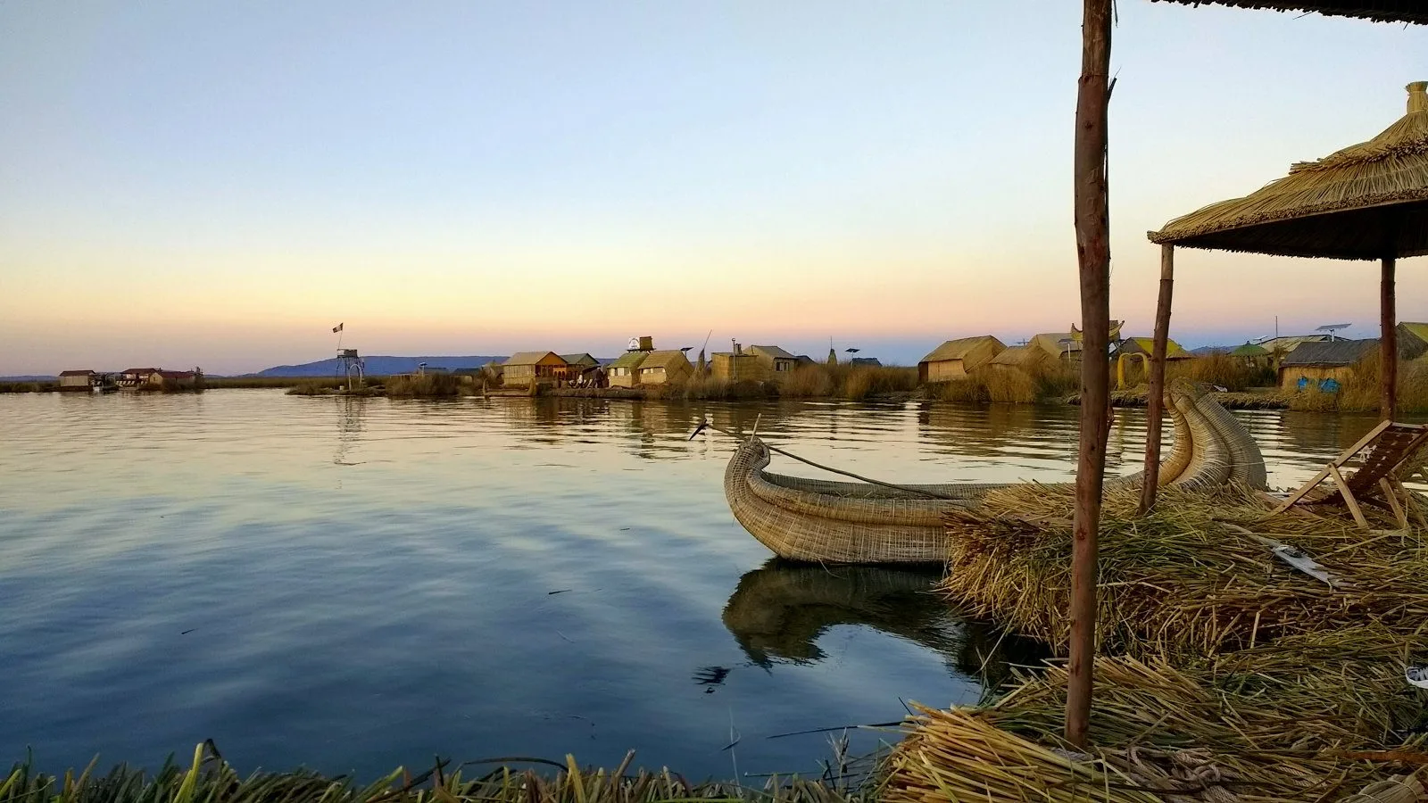 This reed boat took a month for our host family to make. In this photo, you can also see the floating island and its floating reed houses!