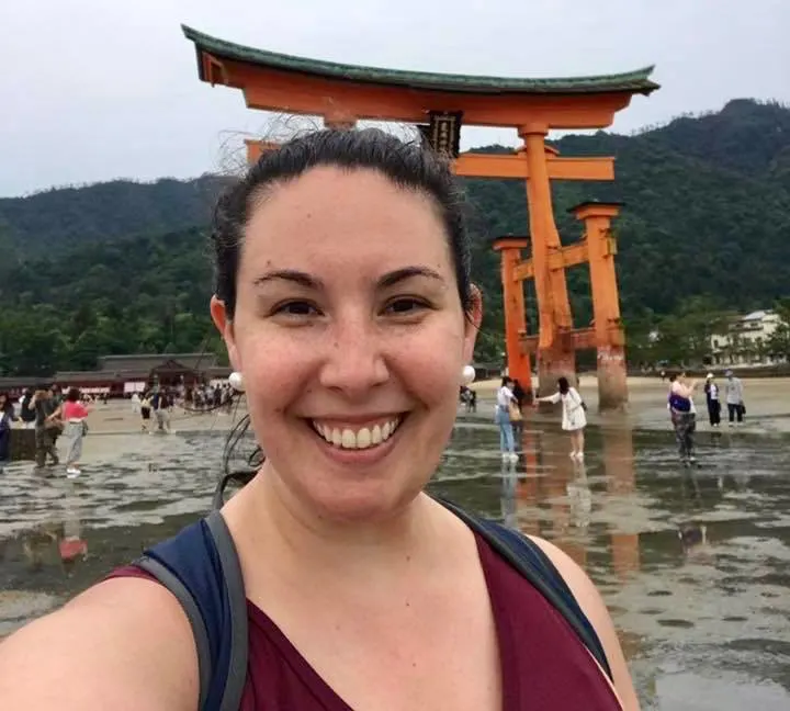 Stephanie at the torii gate of Miyajima, Japan: a UNESCO Heritage site.