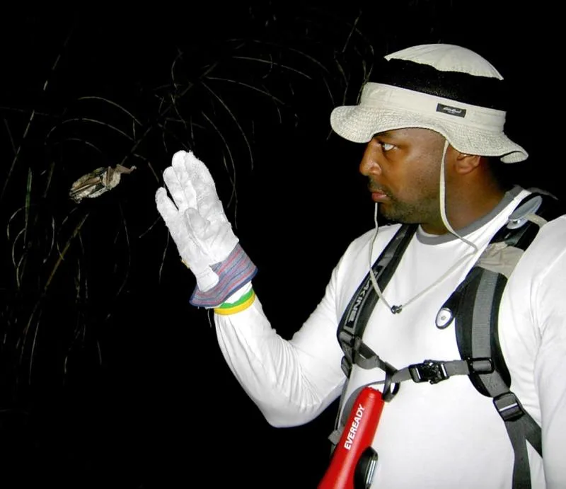 Eugene Roundtree (and a bat!) on the Earthwatch Fellowship in Brazil. Photo by Brandon Finegold.