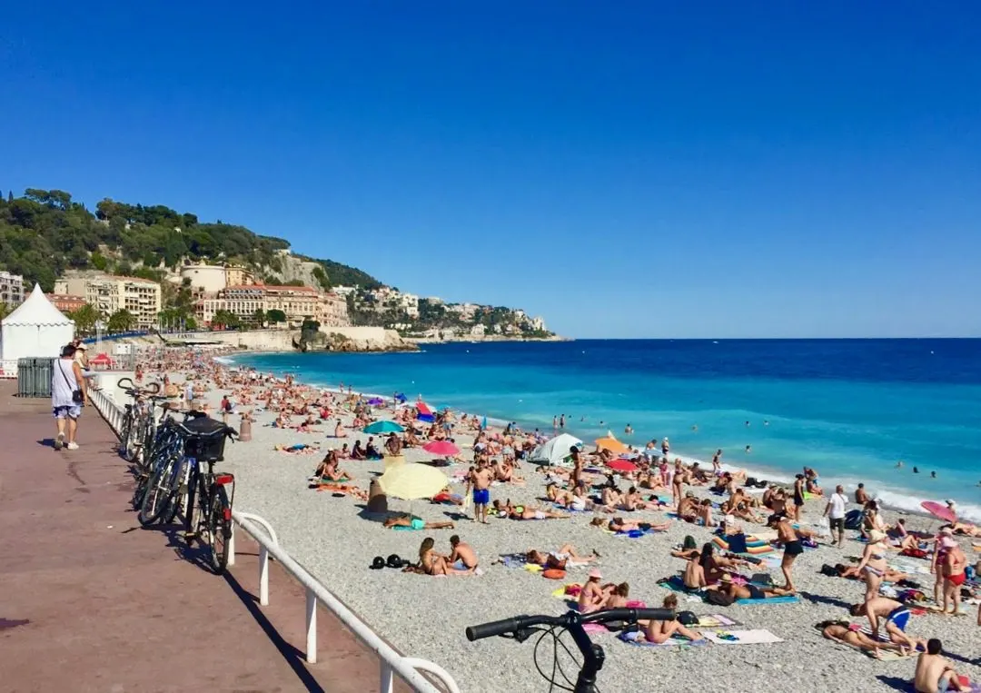 The beach on the Mediterranean Sea near the Promenade des Anglais in Nice, France.