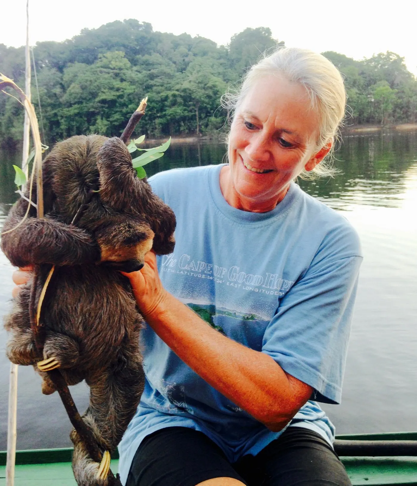 Holding a sloth in a remote village in Brazil.