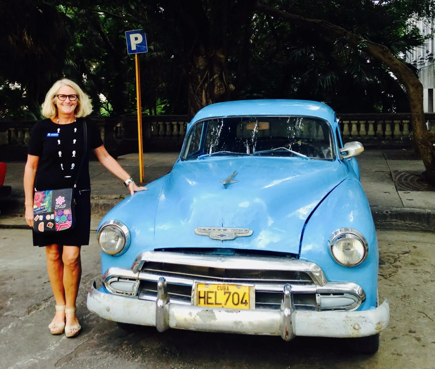 With a vintage car in Havana, Cuba.