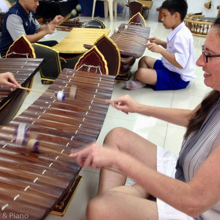 Fiona trying out a traditional Thai instrument.