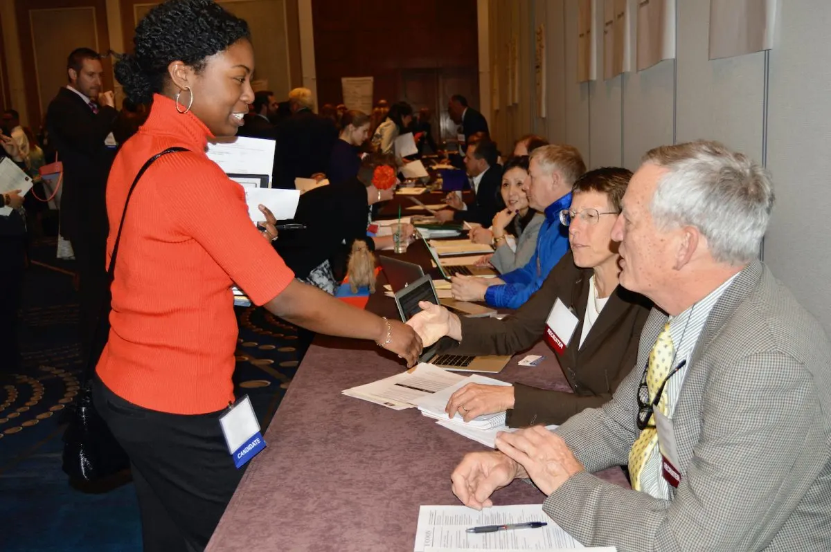 Meeting teaching candidates at a Search Associates fair.