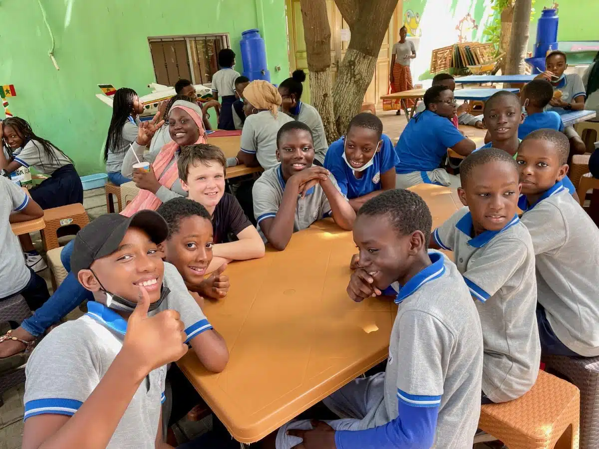 Elizabeth's son visiting their partner school in Dakar, Senegal.