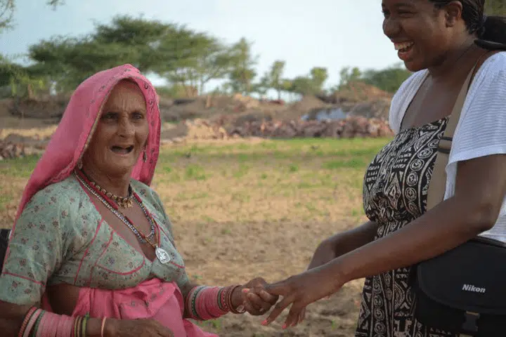 Jaipur, India with a local lady marveling Nicole's painted nails.