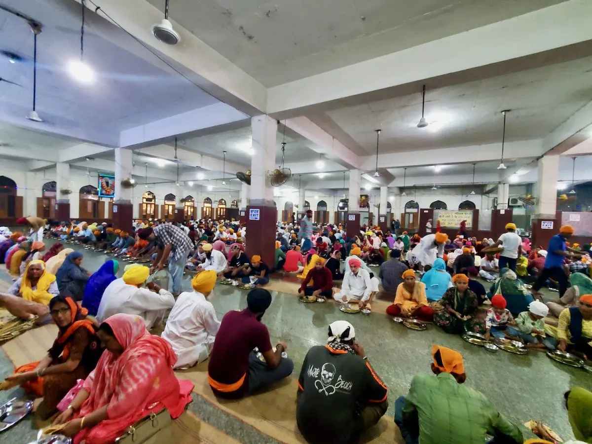 Guests participate in Langar at the Golden Temple.