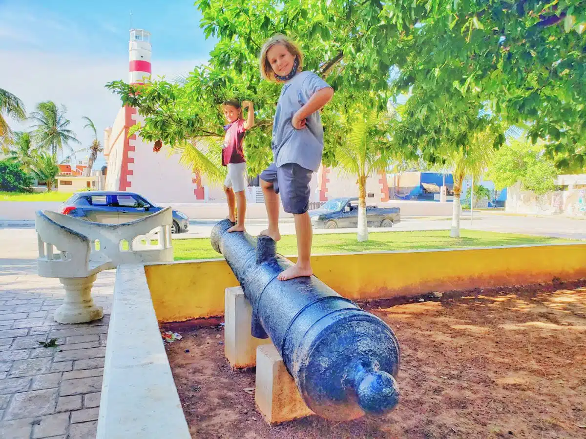 Kids on canon in Sisal, Mexico.