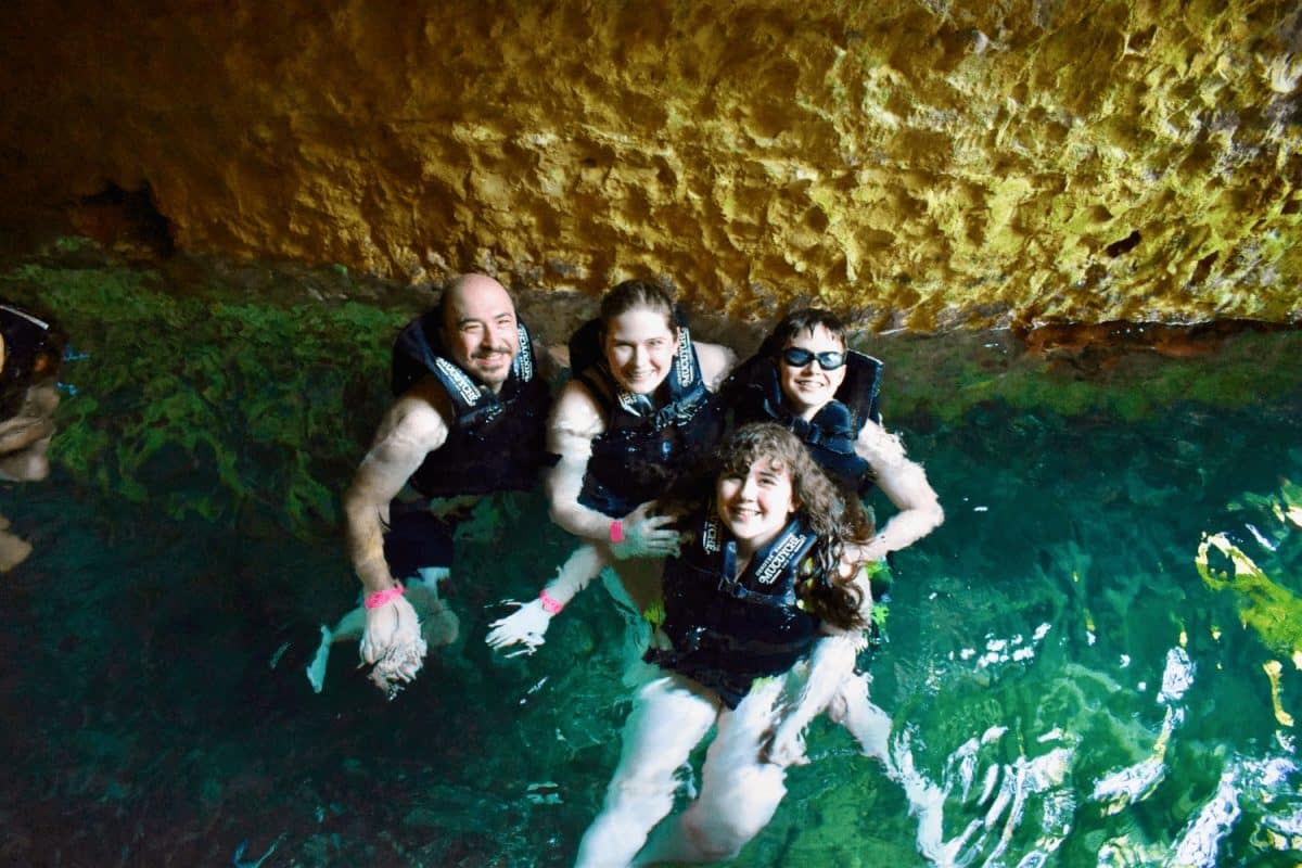 Swimming in a cenote at Hacienda Mucuyche, Mexico.