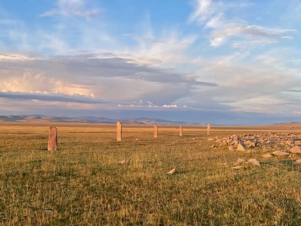The view of the deerstones at Jargalantyn Am, the largest Deer Stone / Khirigsuur (DSK) site in Mongolia. (ACMS July 2024.)