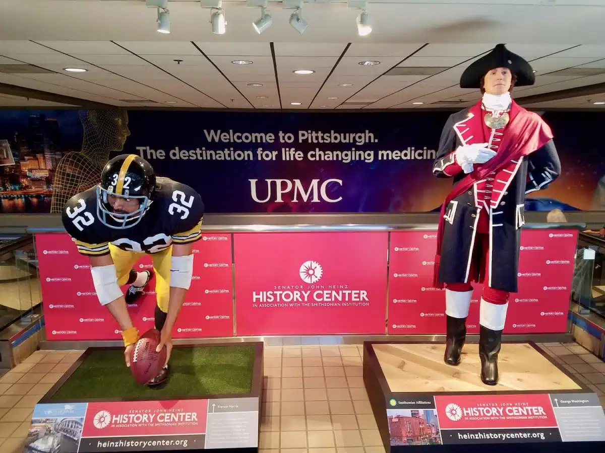 Two noted historical figures at Pittsburgh International Airport (Franco Harris & Washington).